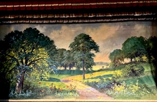 Painted stage backdrop with pastoral landscape